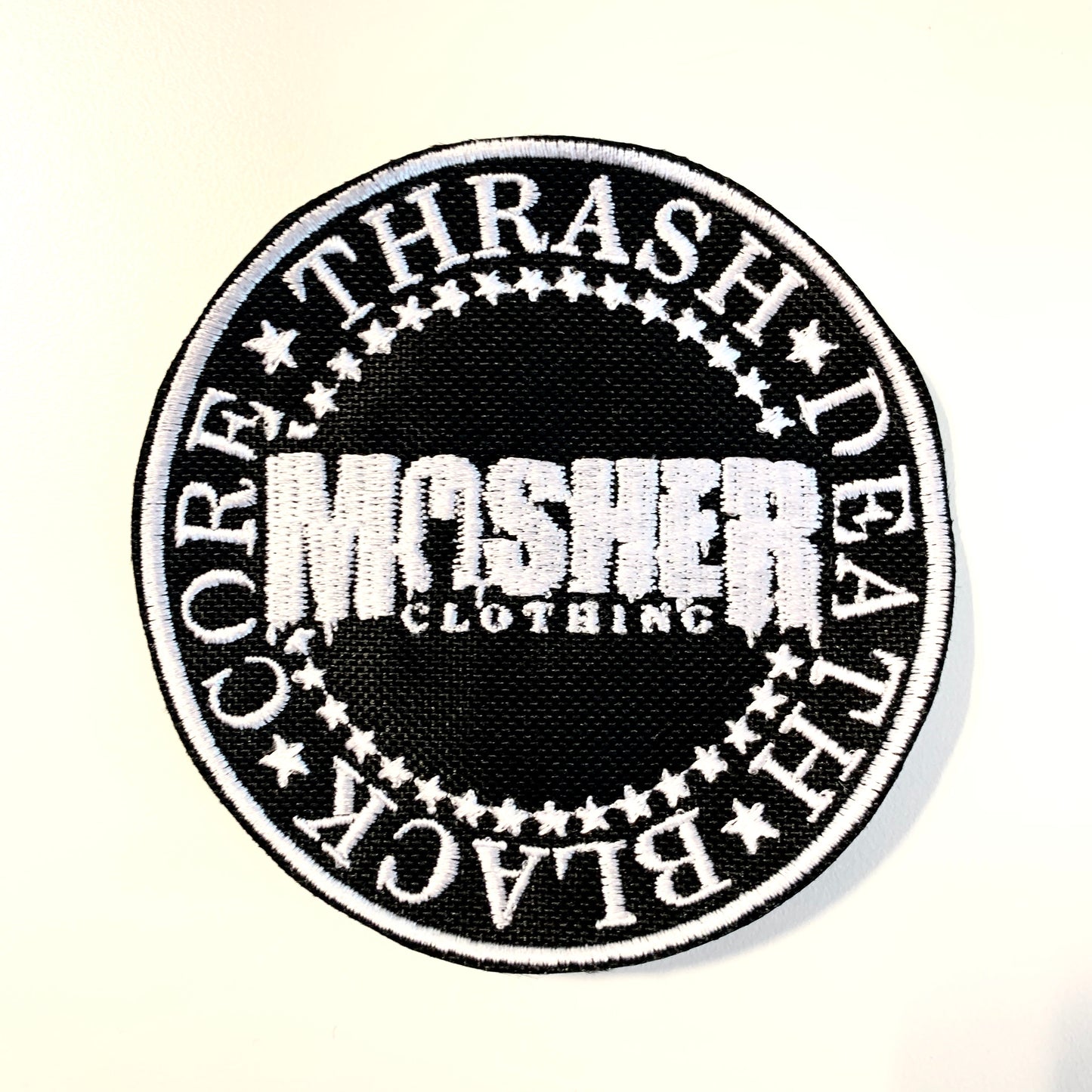 Parche circular con el logotipo de Mosher