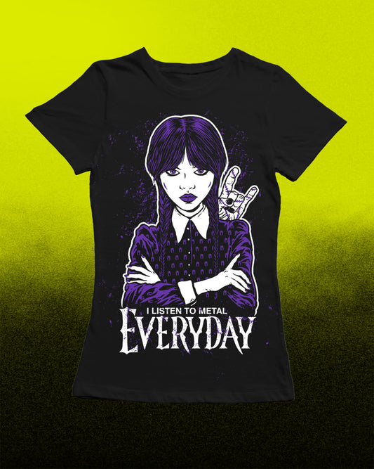A black short-sleeve graphic T-shirt displayed against a bright yellow-to-black gradient background. The shirt features a stylized illustration of a young woman with purple hair and a school uniform, making a hand gesture, with the text 'I LISTEN TO METAL EVERYDAY' printed below in white.