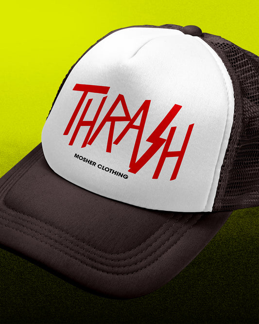 A close-up of a trucker hat with a white front panel and dark brown mesh sides and brim. The front panel features the word 'THRASH' in large red stylized letters with 'MOSHER CLOTHING' printed below in black.