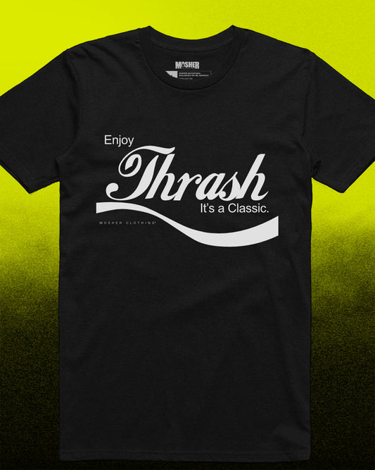 A black short-sleeve t-shirt with a white graphic print reading 'Enjoy Thrash It's a Classic.' on the front, displayed against a bright yellow-to-black gradient background.